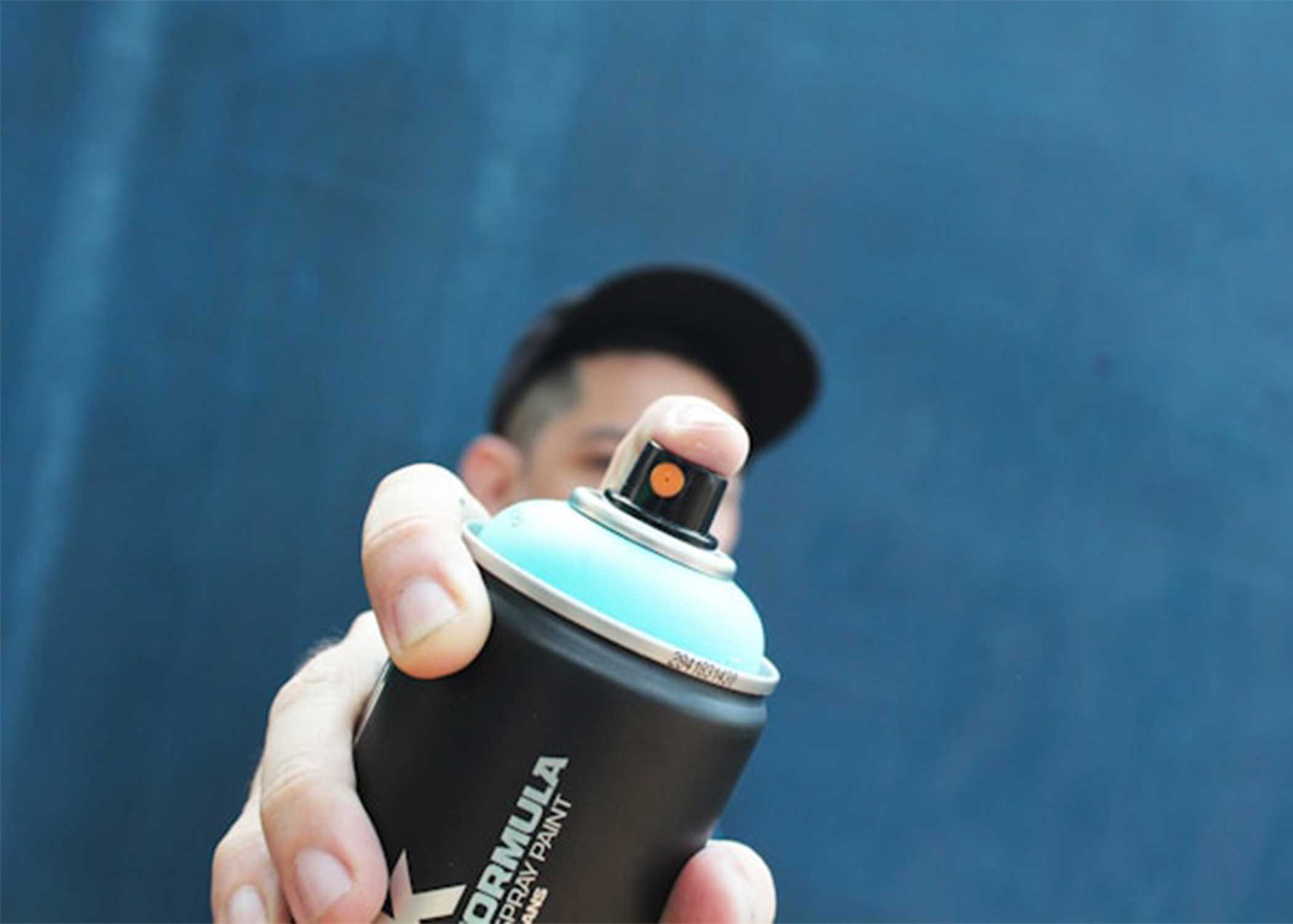 Creator portrait spraying spray paint