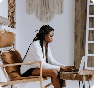 woman working on a laptop in a scandinavian living room